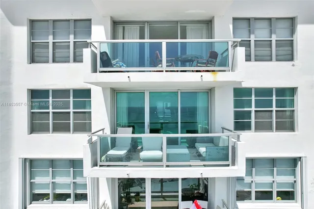 a front view of a building with a lot of windows