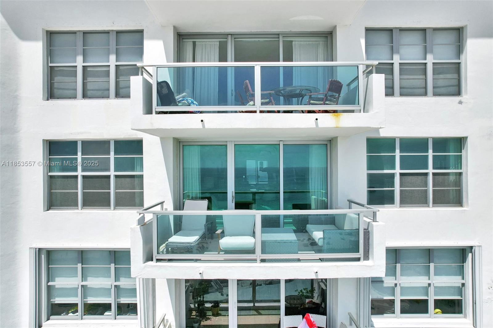 5151 Collins Avenue, Unit 1519 Miami Beach, FL 33140 - Photo 28 of 42 a front view of a building with a lot of windows
