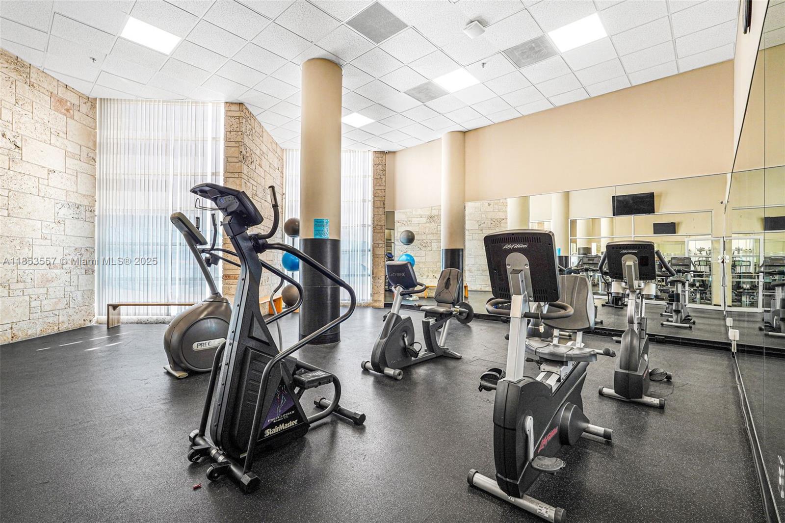 5151 Collins Avenue, Unit 1519 Miami Beach, FL 33140 - Photo 36 of 42 a view of a room with gym equipment