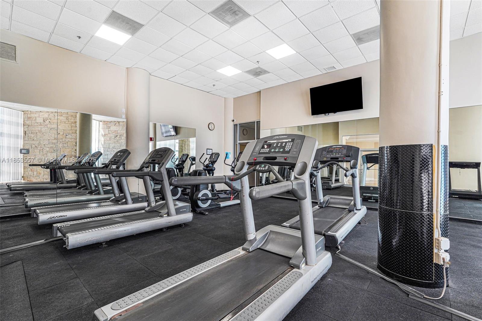 5151 Collins Avenue, Unit 1519 Miami Beach, FL 33140 - Photo 39 of 42 a view of a room with gym equipment
