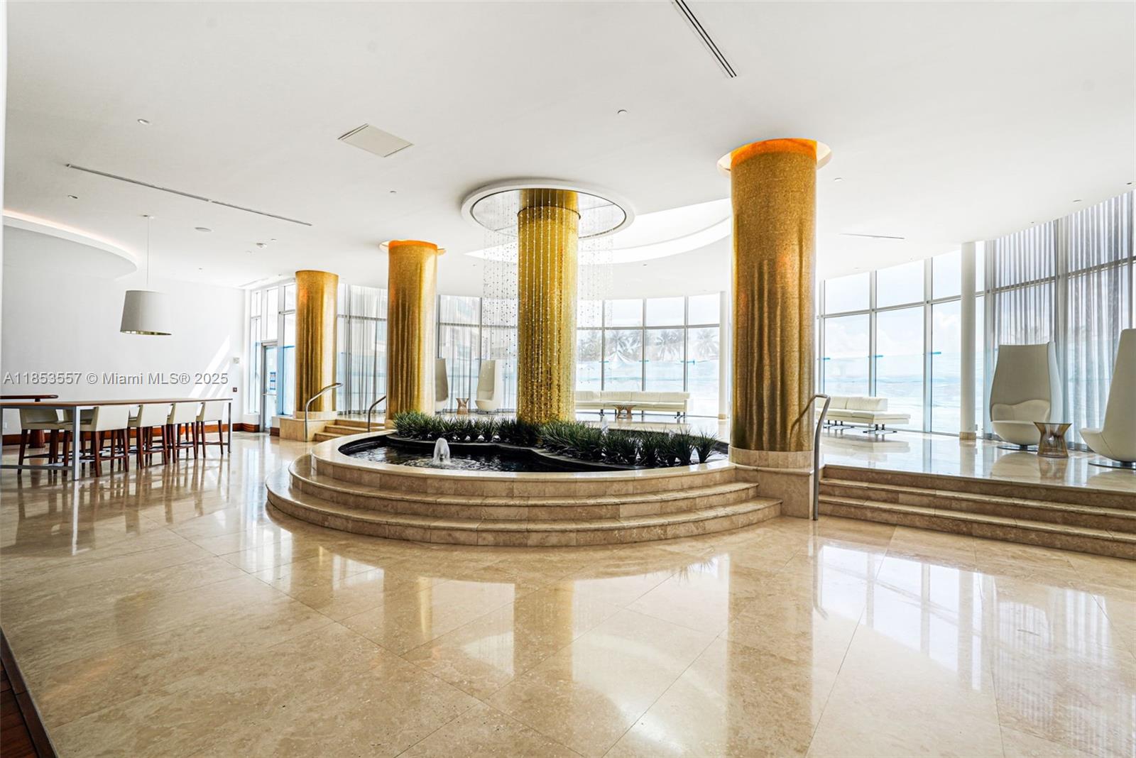 5151 Collins Avenue, Unit 1519 Miami Beach, FL 33140 - Photo 41 of 42 a living room with large windows