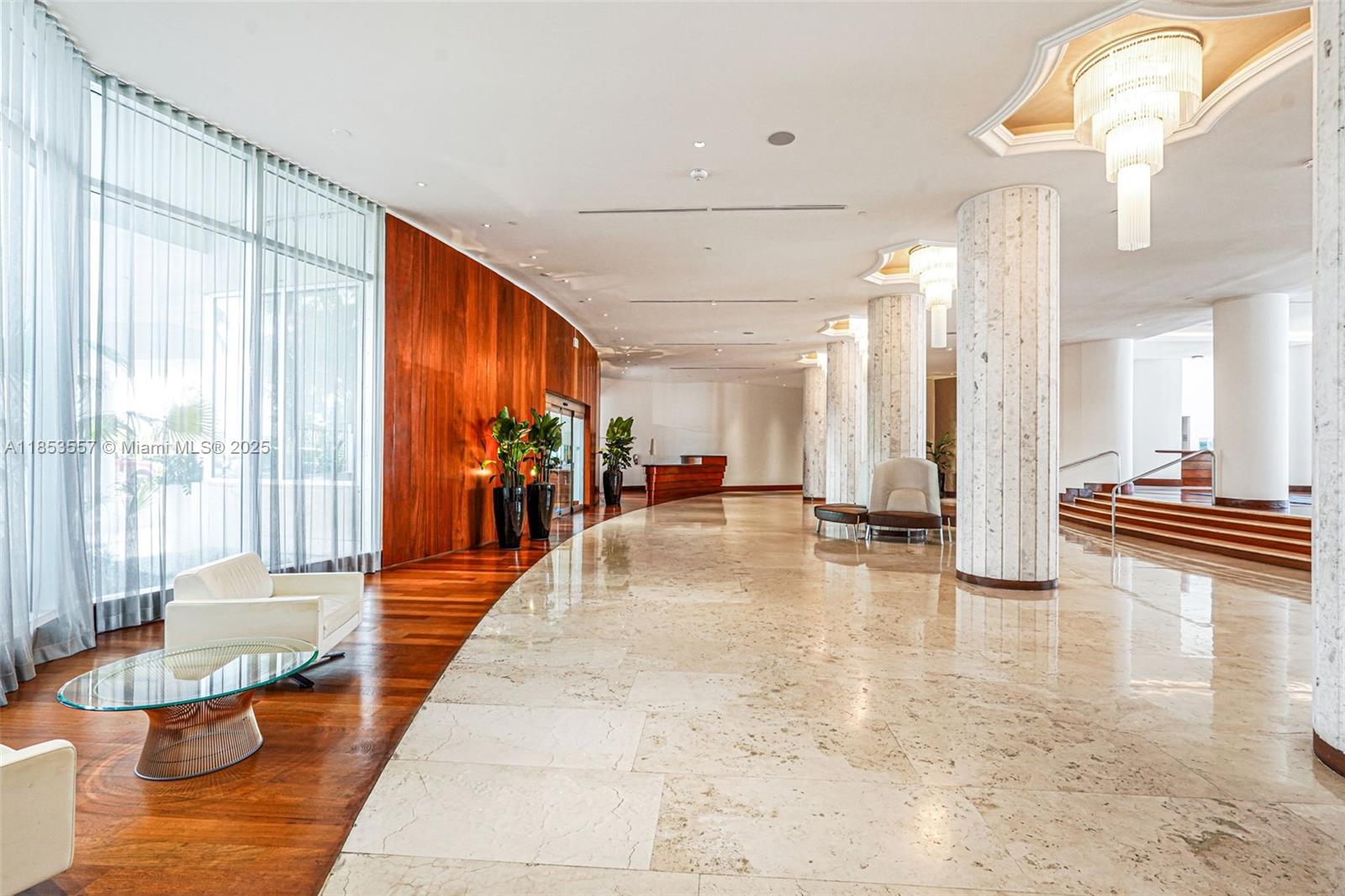 5151 Collins Avenue, Unit 1519 Miami Beach, FL 33140 - Photo 42 of 42 a lobby with furniture and floor to ceiling window