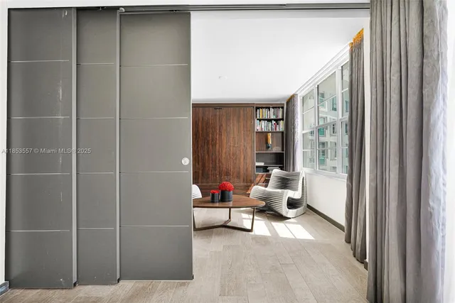 a living room with furniture and white walls