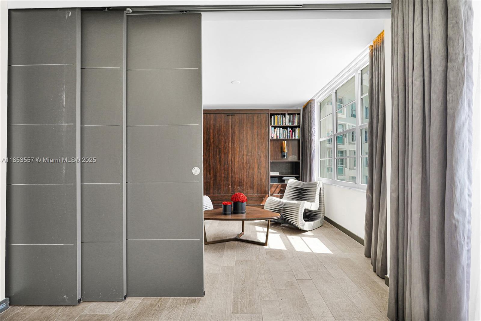 5151 Collins Avenue, Unit 1519 Miami Beach, FL 33140 - Photo 9 of 42 a living room with furniture and white walls