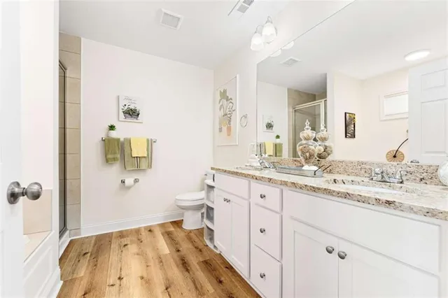 a spacious bathroom with a sink and a mirror