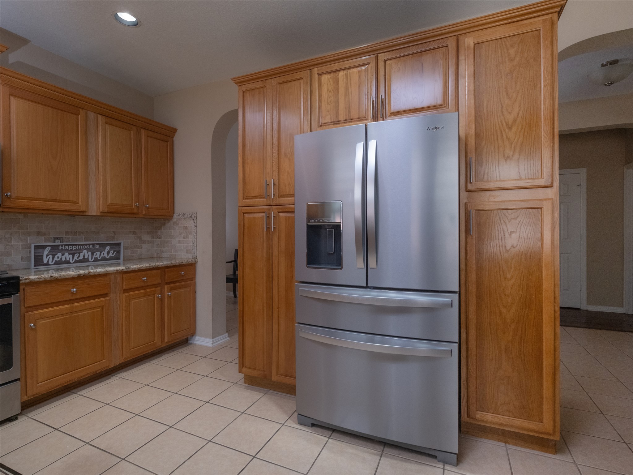 19327 Dickson Park Drive Spring, TX 77373 - Photo 11 of 47 a kitchen with stainless steel appliances granite countertop a refrigerator and a stove
