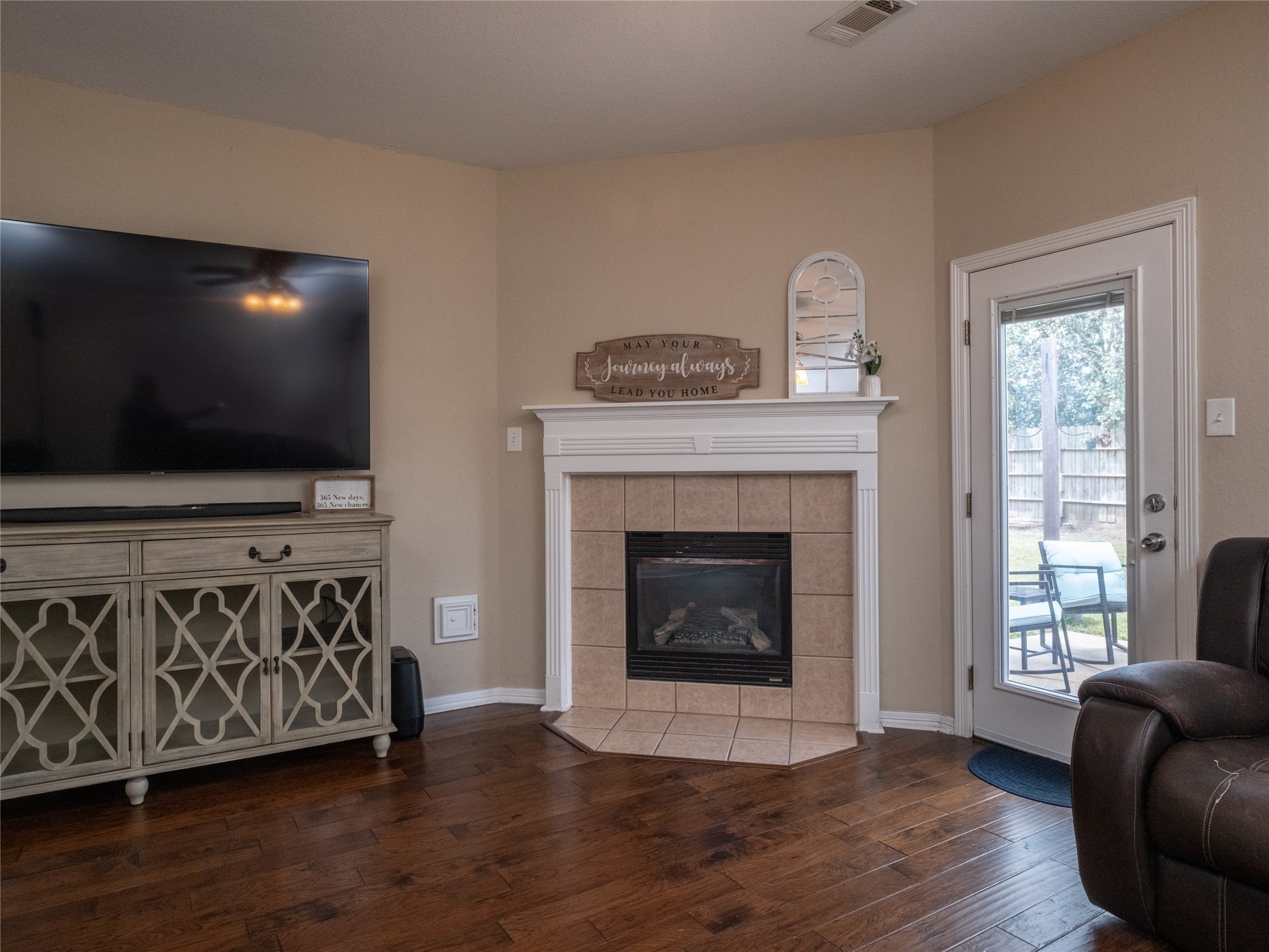 19327 Dickson Park Drive Spring, TX 77373 - Photo 14 of 47 a living room with furniture a flat screen tv and a fireplace