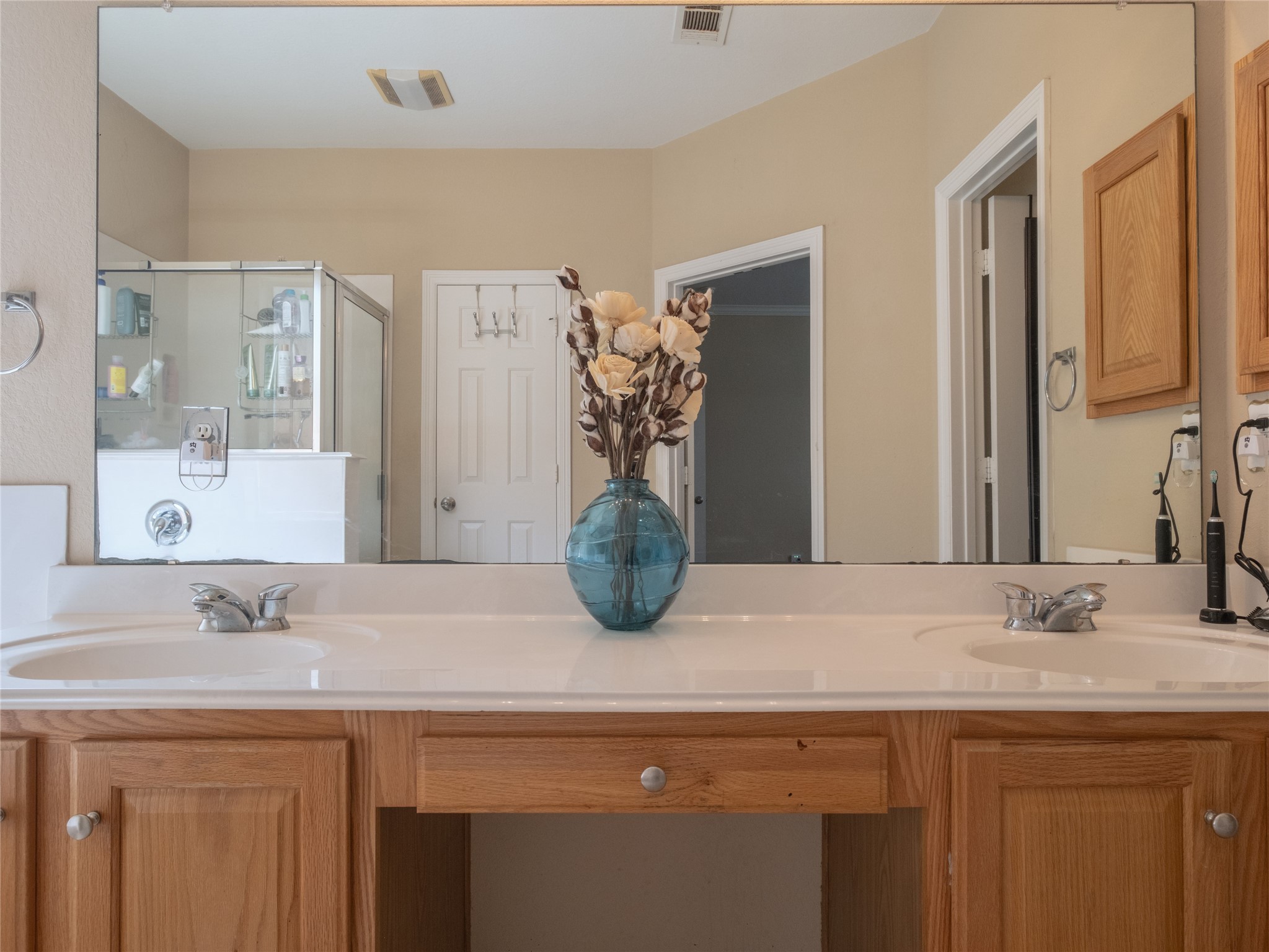 19327 Dickson Park Drive Spring, TX 77373 - Photo 25 of 47 a bathroom with a sink a mirror and vanity