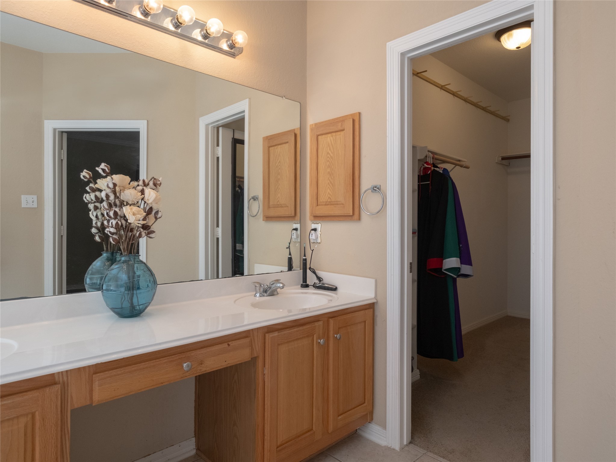 19327 Dickson Park Drive Spring, TX 77373 - Photo 26 of 47 a bathroom with a sink and a mirror