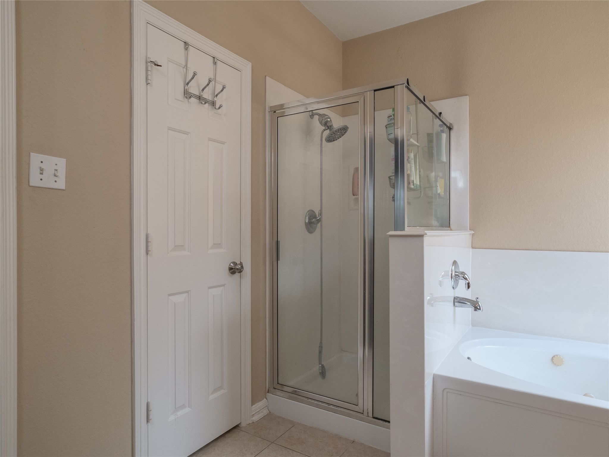 19327 Dickson Park Drive Spring, TX 77373 - Photo 27 of 47 a bathroom with a shower and a tub