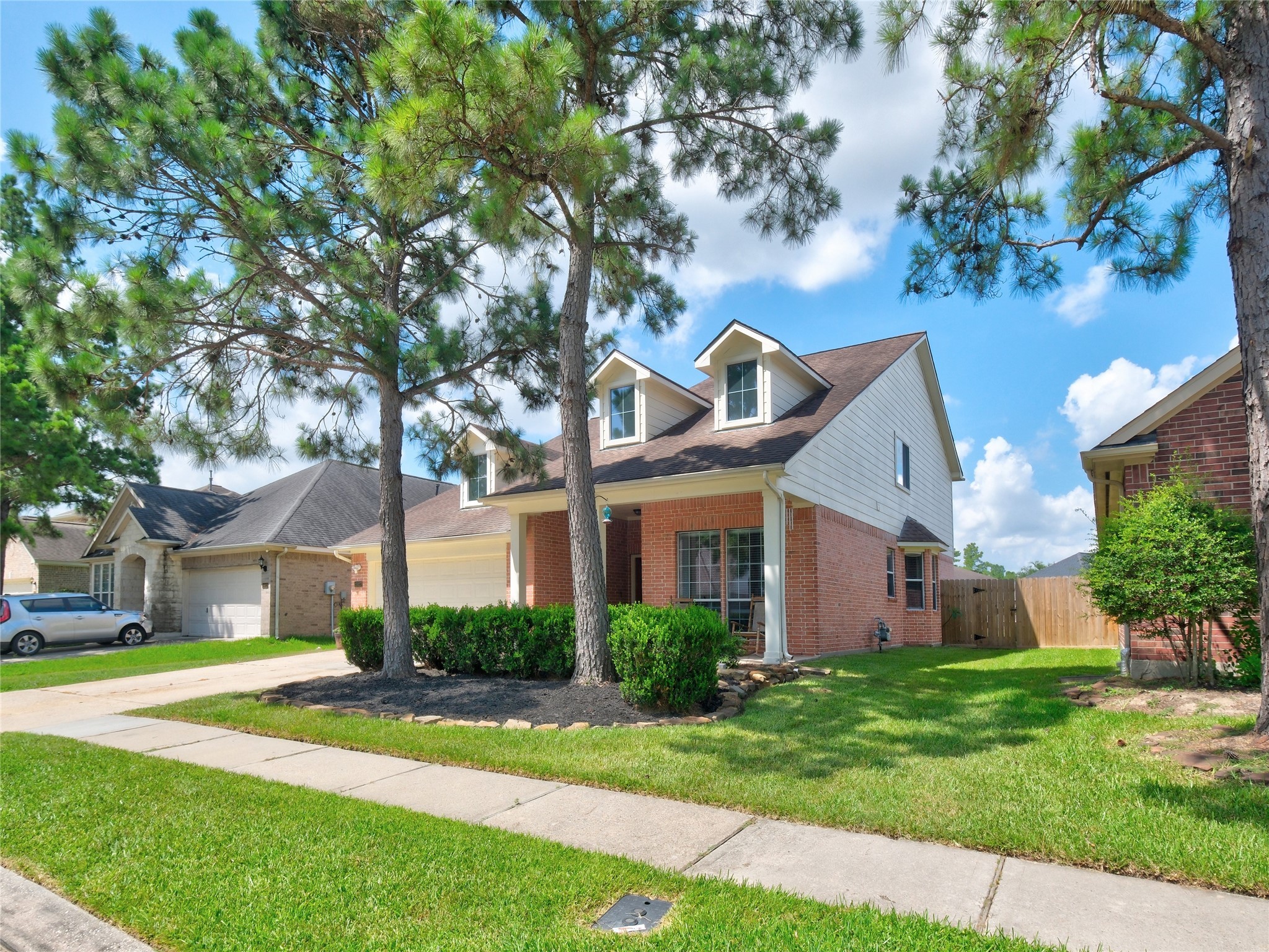 19327 Dickson Park Drive Spring, TX 77373 - Photo 3 of 47 a front view of a house with a yard