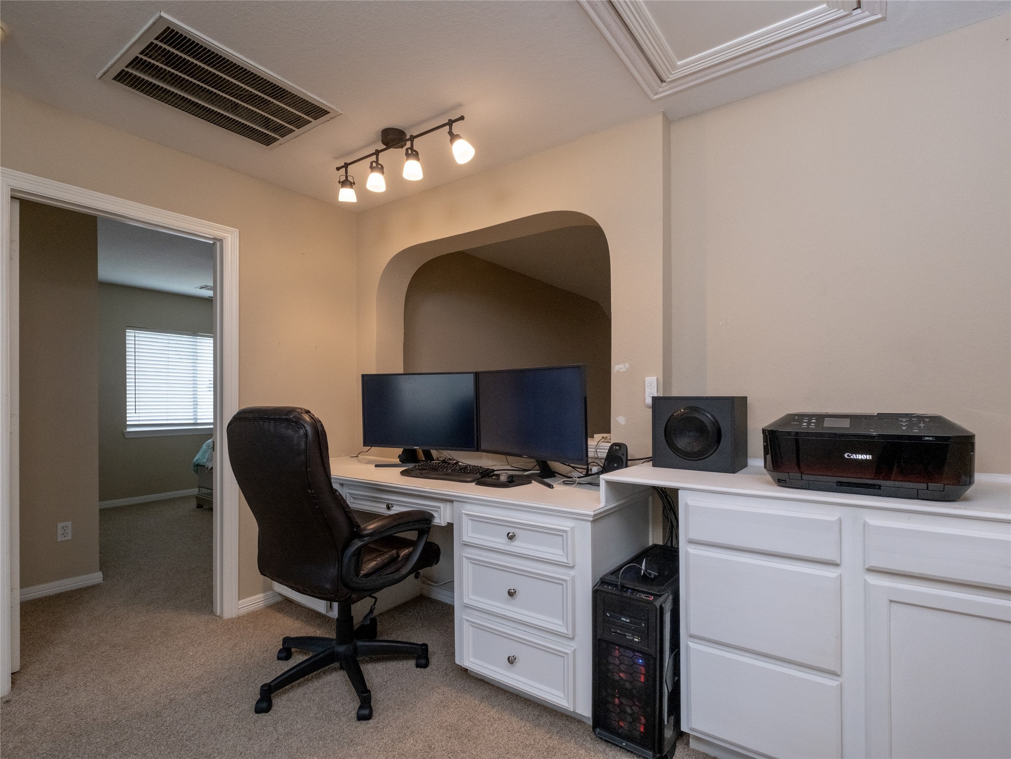19327 Dickson Park Drive Spring, TX 77373 - Photo 31 of 47 a view of a workspace with furniture and a fan