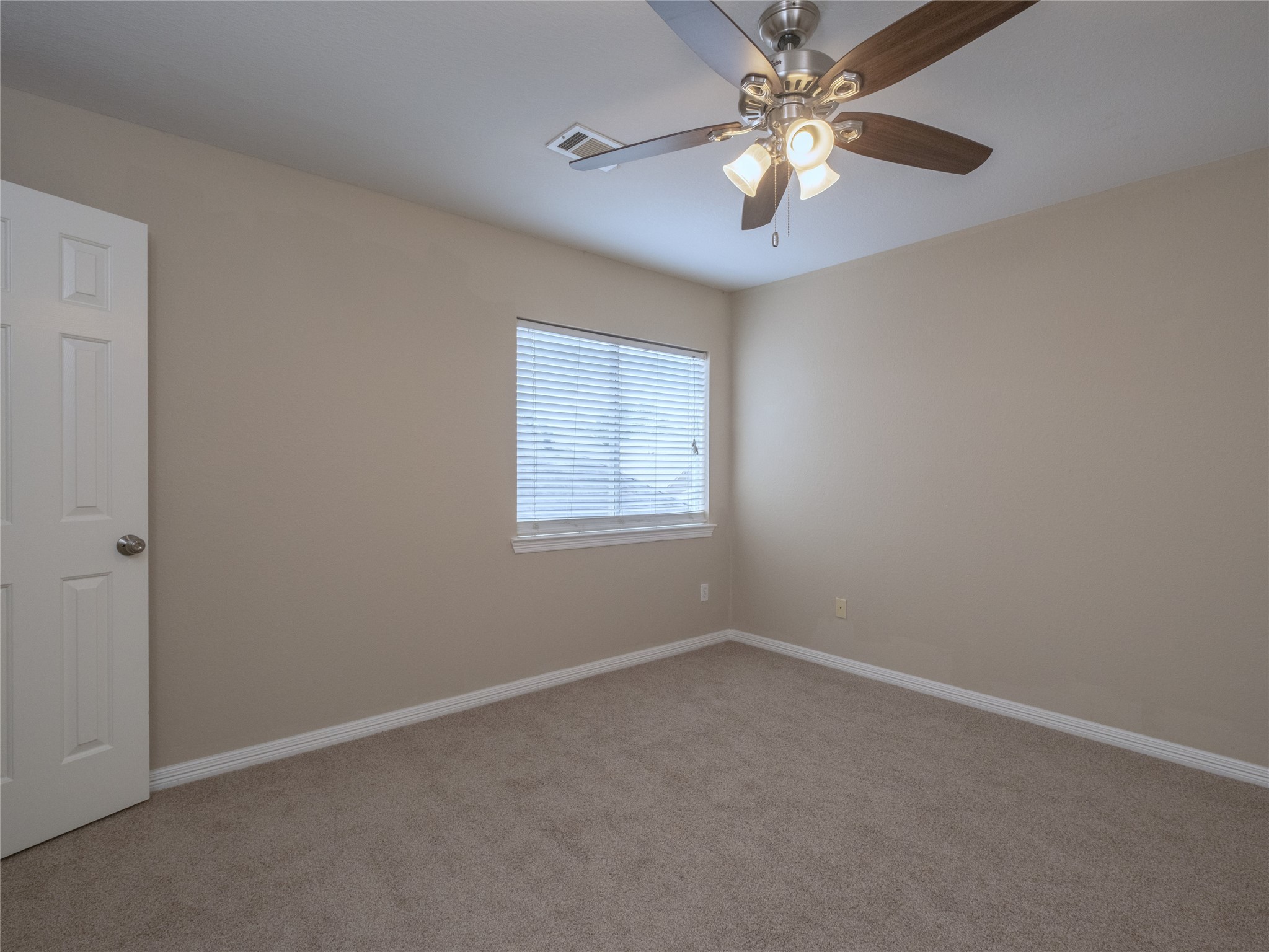 19327 Dickson Park Drive Spring, TX 77373 - Photo 33 of 47 an empty room with a window and a fan