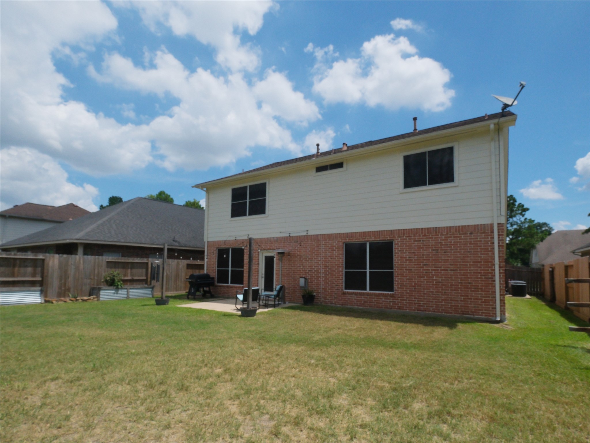 19327 Dickson Park Drive Spring, TX 77373 - Photo 46 of 47 a view of a house with a backyard
