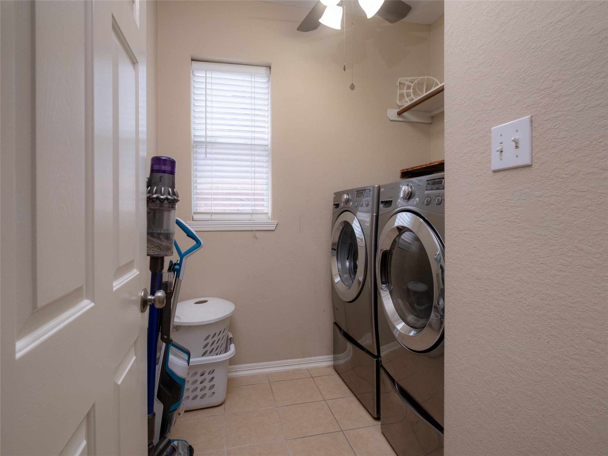 19327 Dickson Park Drive Spring, TX 77373 - Photo 8 of 47 a utility room with dryer washer and a window