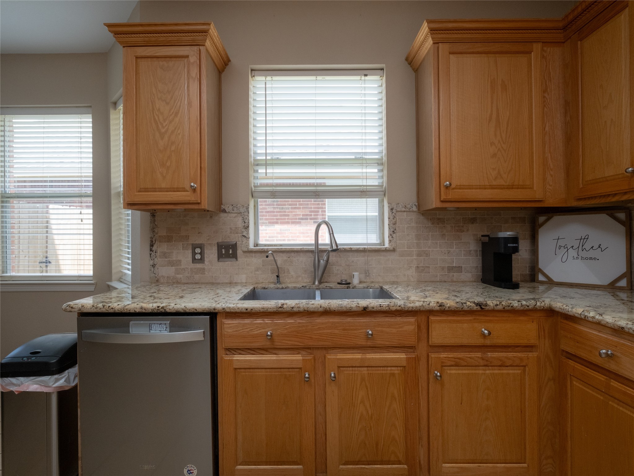 19327 Dickson Park Drive Spring, TX 77373 - Photo 9 of 47 a kitchen with granite countertop cabinets sink and window