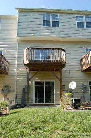 7653 Winners Edge Street Raleigh, NC 27617 - Photo 2 of 12 a front view of a house with garden