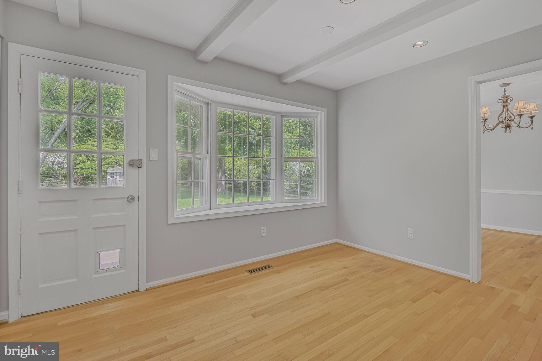 11733 Ambleside Drive Potomac, MD 20854 - Photo 11 of 29 a view of empty room with wooden floor and fan