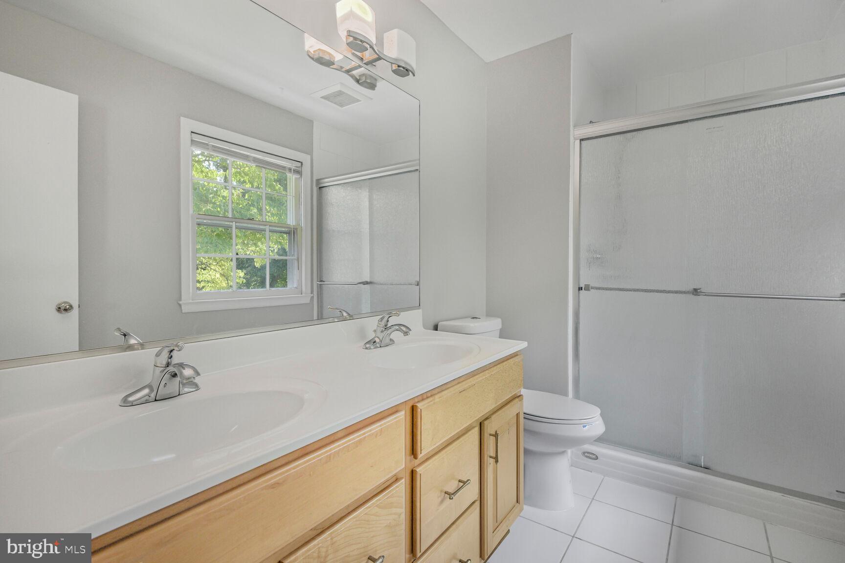 11733 Ambleside Drive Potomac, MD 20854 - Photo 16 of 29 a bathroom with a sink toilet and vanity