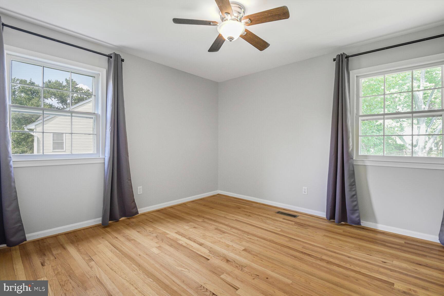 11733 Ambleside Drive Potomac, MD 20854 - Photo 18 of 29 a view of empty room with wooden floor and fan