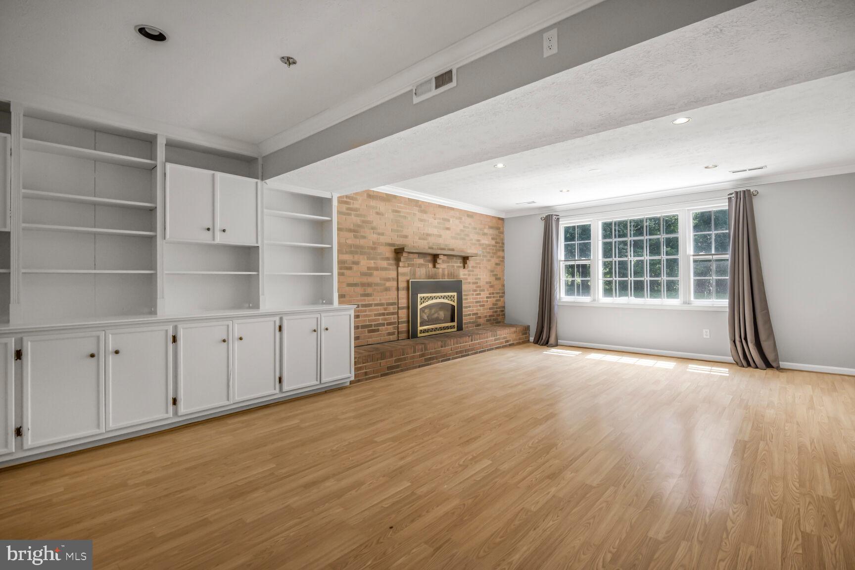 11733 Ambleside Drive Potomac, MD 20854 - Photo 21 of 29 an empty room with cabinet and windows