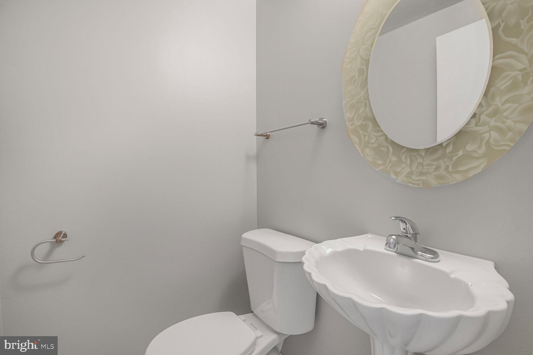 11733 Ambleside Drive Potomac, MD 20854 - Photo 22 of 29 a bathroom with a sink and a mirror