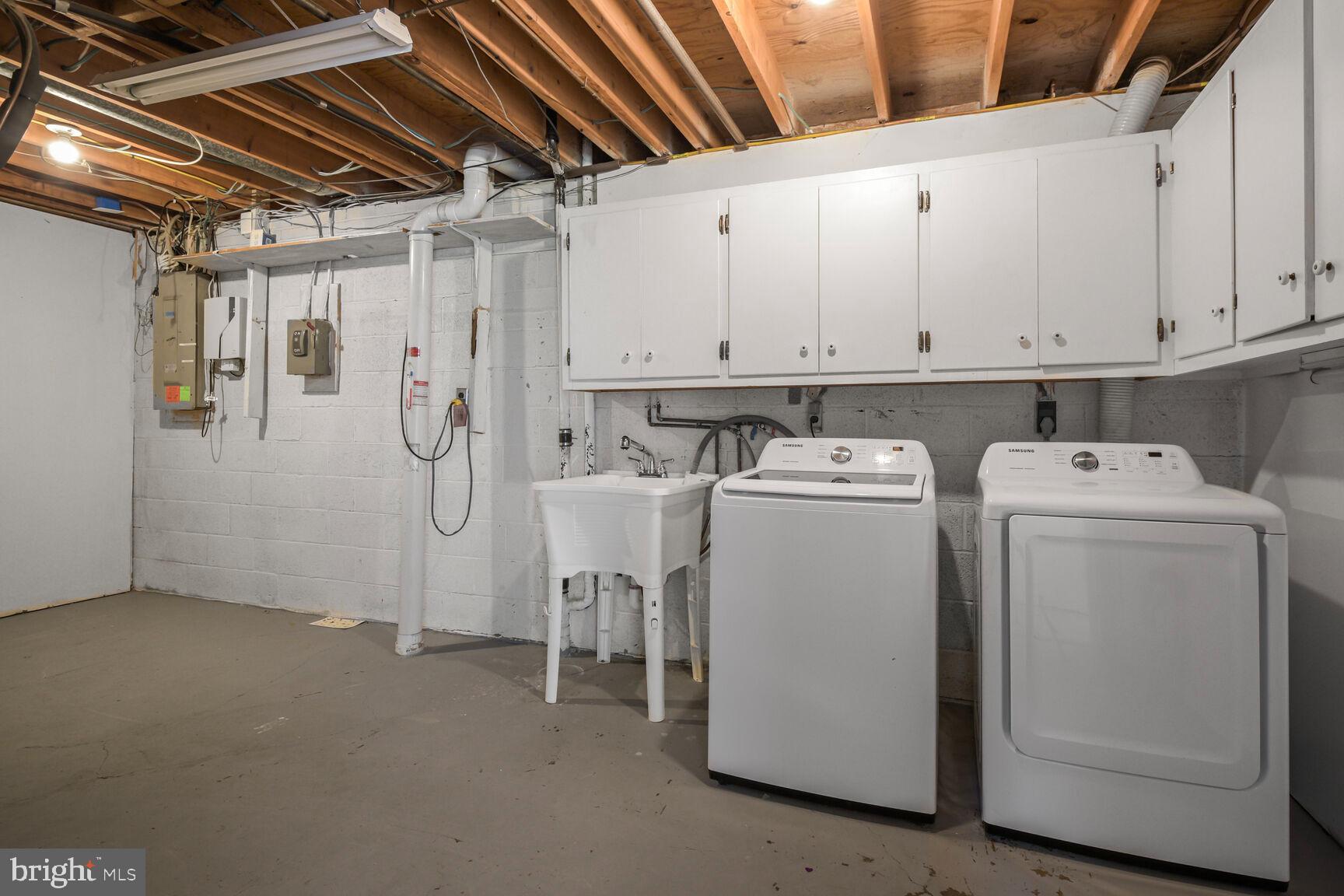 11733 Ambleside Drive Potomac, MD 20854 - Photo 24 of 29 a utility room with dryer and washer