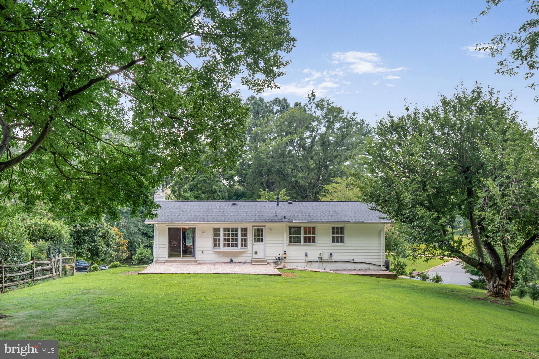 11733 Ambleside Drive Potomac, MD 20854 - Photo 27 of 29 a front view of a house with a garden