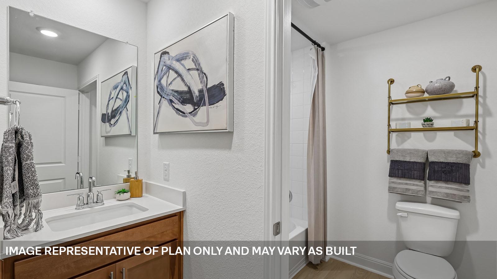 244 Rivers Edge Drive Georgetown, TX 78628 - Photo 27 of 37 a bathroom with a sink and a mirror