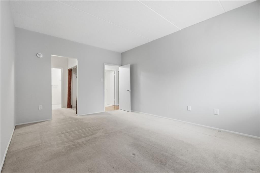 5600 Munhall Road, Unit 202 Pittsburgh, PA 15217 - Photo 11 of 24 a view of an empty room with closet and a window