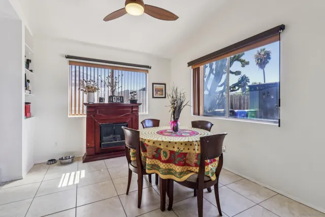 a dining room with furniture and window