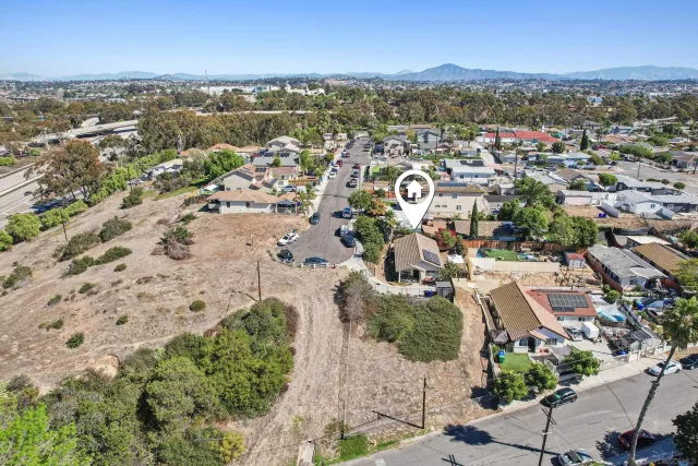 an aerial view of a city with lots of residential buildings