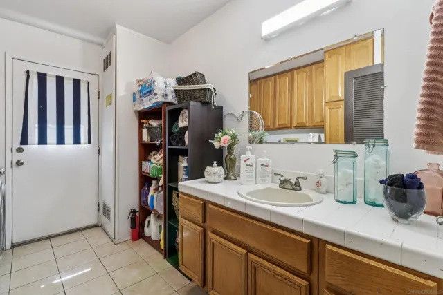 a kitchen with a sink and cabinets