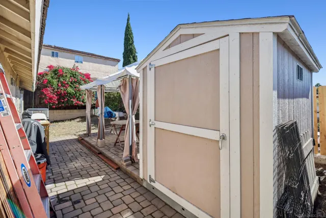 a view of a backyard of the house