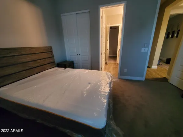 a bedroom with furniture and a window