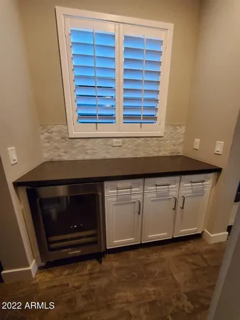 a kitchen with granite countertop a sink and a stove