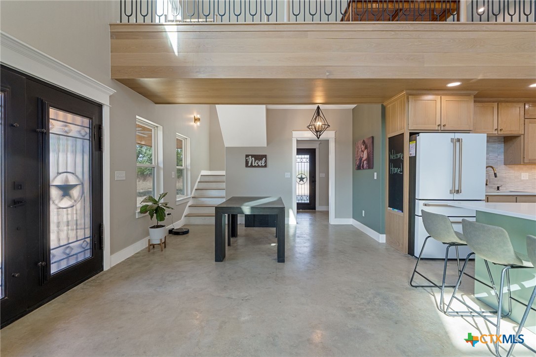 18248 Crows Ranch Road Salado, TX 76571 - Photo 15 of 48 a lobby with furniture and a potted plant