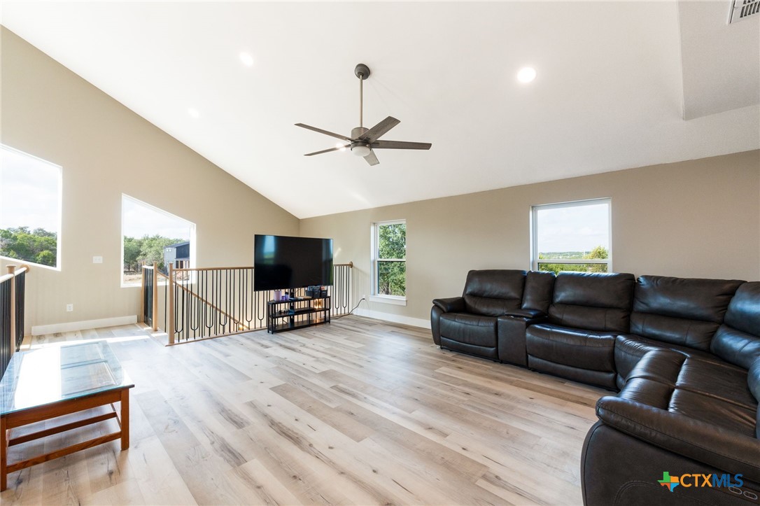 18248 Crows Ranch Road Salado, TX 76571 - Photo 23 of 48 a living room with furniture and a flat screen tv