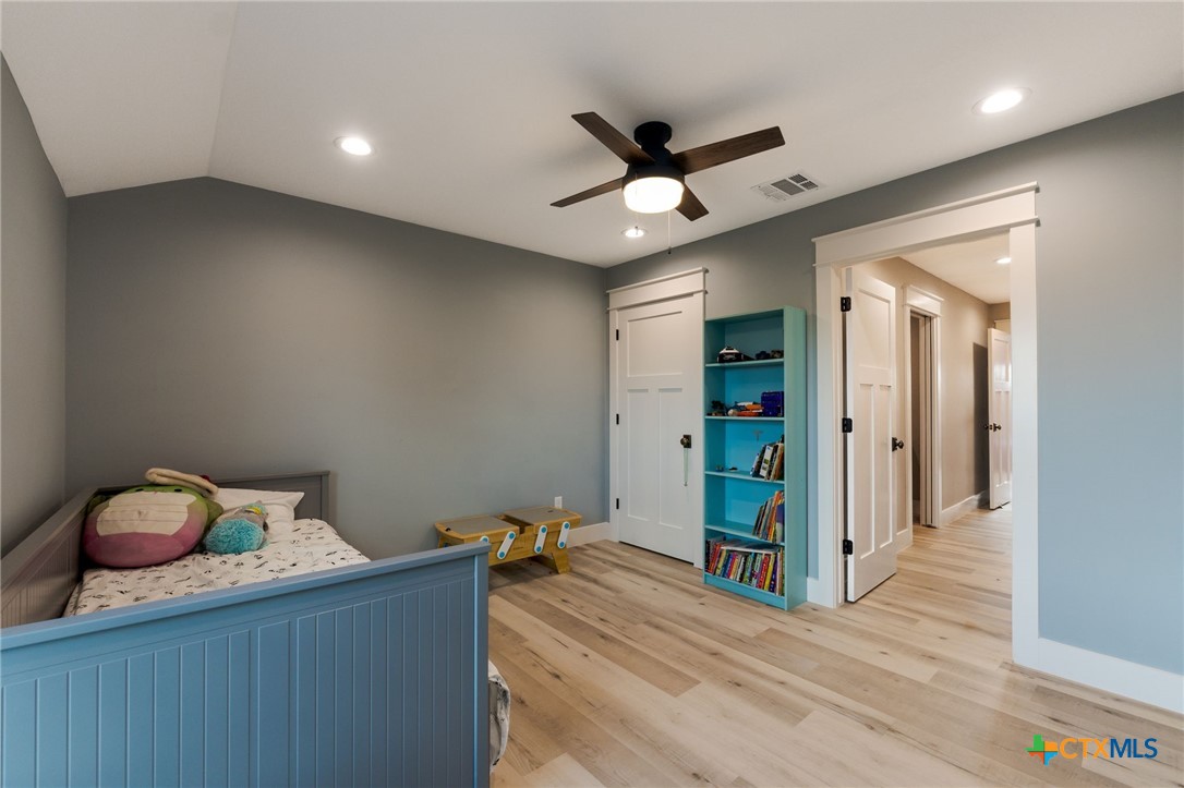 18248 Crows Ranch Road Salado, TX 76571 - Photo 26 of 48 a view of a hallway with wooden floor and closet