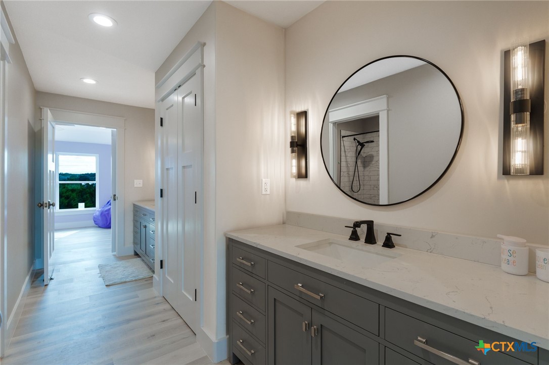 18248 Crows Ranch Road Salado, TX 76571 - Photo 27 of 48 a bathroom with a sink and a mirror