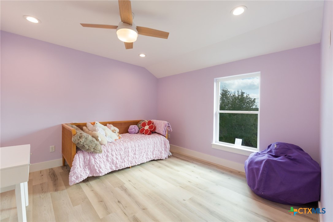 18248 Crows Ranch Road Salado, TX 76571 - Photo 30 of 48 a living room with a bed furniture and a window