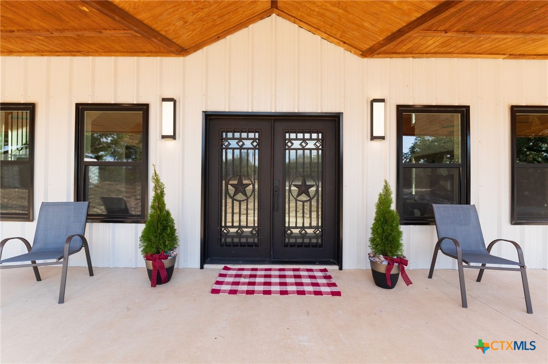 18248 Crows Ranch Road Salado, TX 76571 - Photo 5 of 48 a view of living room filled with furniture and windows