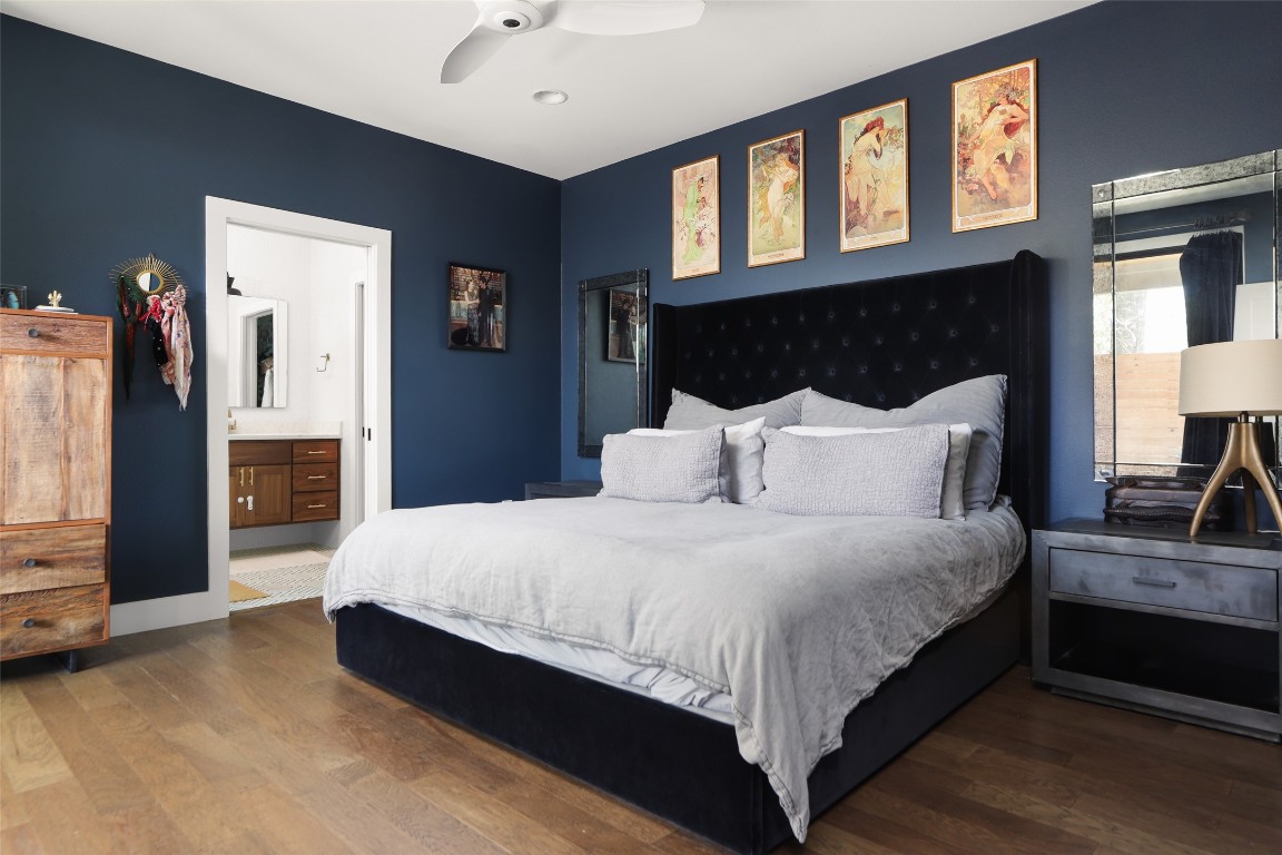 4420 Mt Vernon Drive, Unit A Austin, TX 78745 - Photo 13 of 35 a large bed sitting in a bedroom next to a window and a flat tv screen