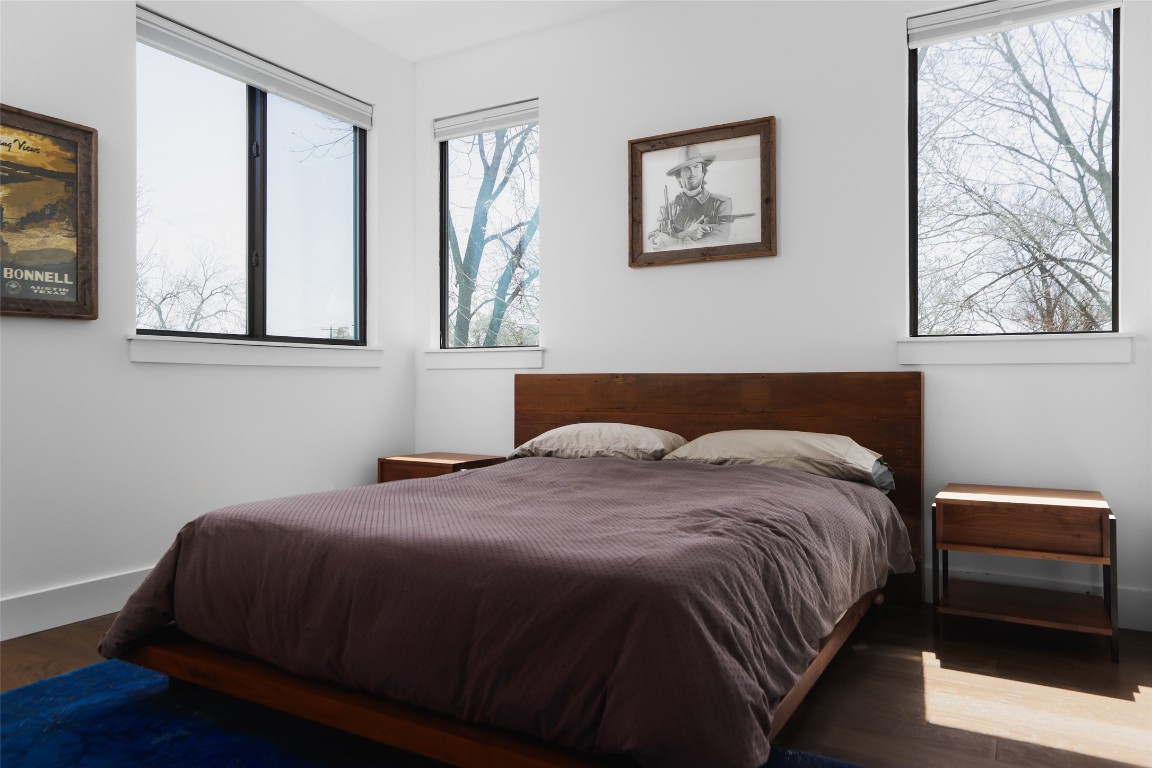 4420 Mt Vernon Drive, Unit A Austin, TX 78745 - Photo 18 of 35 a bedroom with a bed and wooden floor