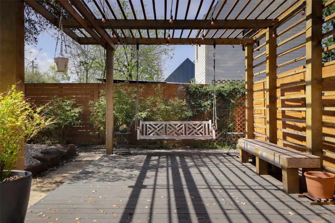 4420 Mt Vernon Drive, Unit A Austin, TX 78745 - Photo 24 of 35 a wooden bench sitting in front of a building