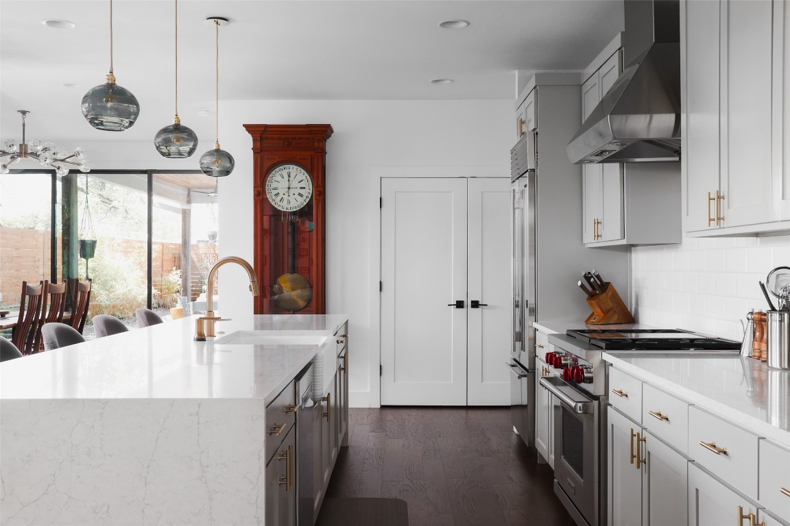 4420 Mt Vernon Drive, Unit A Austin, TX 78745 - Photo 8 of 35 a kitchen with stainless steel appliances granite countertop a sink and a refrigerator