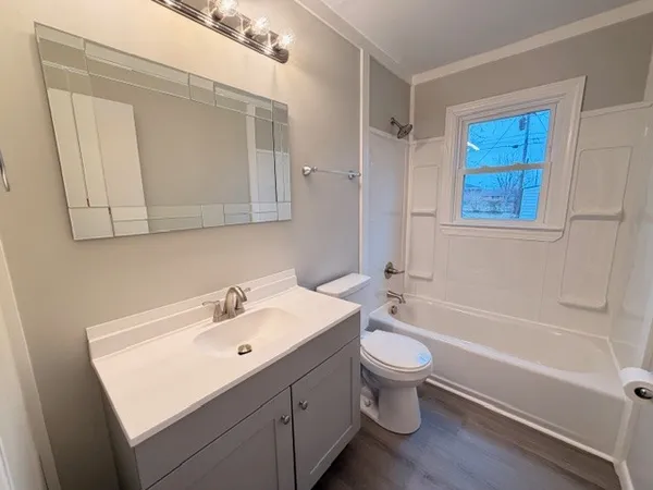 a bathroom with a sink a toilet and a bathtub