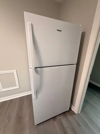 a view of a storage & utility room with wooden floor