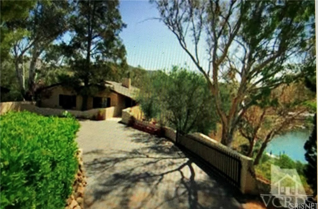 2480 Highpoint Drive Agoura Hills, CA 91301 - Photo 9 of 9 a view of a house with a yard