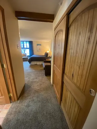 a bedroom with a bed and a couch